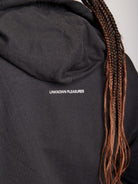 black zip up hoodie with front graphic