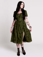a short-sleeved olive green midi dress with a gothic pattern