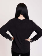 embroidered bat detail on black long sleeve top