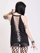 black tank with sheer back panel embroidered with spine motif