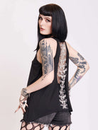 black tank with sheer back panel embroidered with spine motif