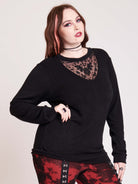 embroidered bat detail on black long sleeve top