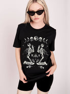 black t-shirt with moon phase and skeleton print.